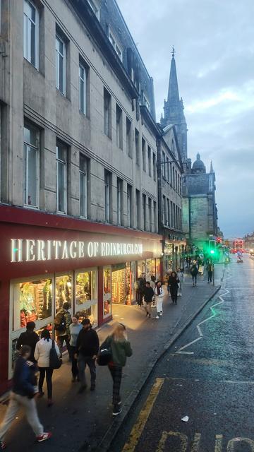 View from top of the bus of South bridge, the old Tron Kirk in distance, in foreground a tacky souvenirs of Scotland shop