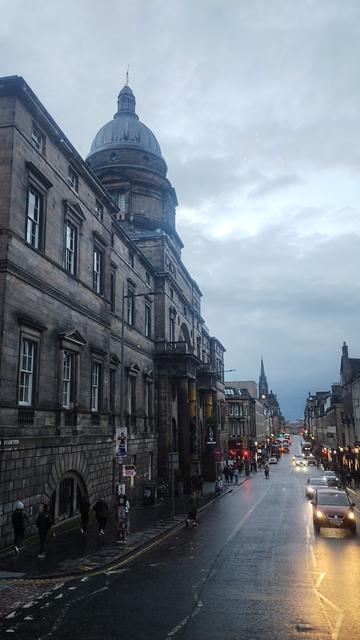 View from top deck of a bus at the facade and dome of Old College