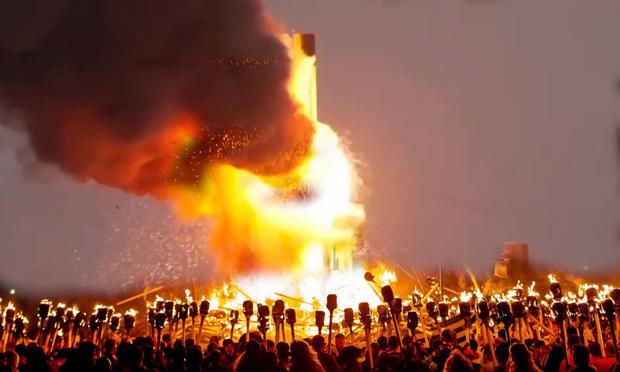 RFA rocket explodes during testing on Unst while many look on in Viking costumes carrying torches from Up Helly Aa