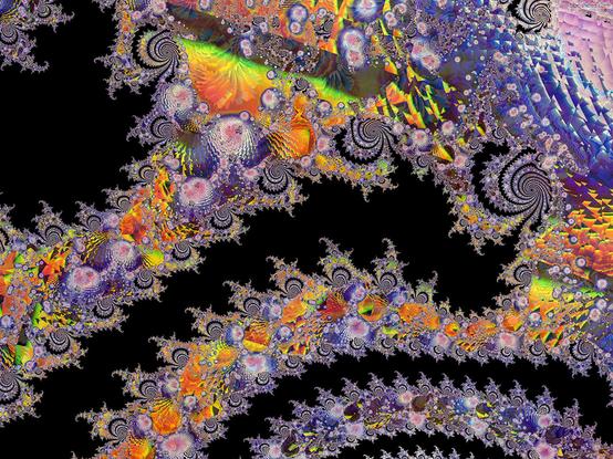 Glass faceted fractal spirals with rainbow colorations
