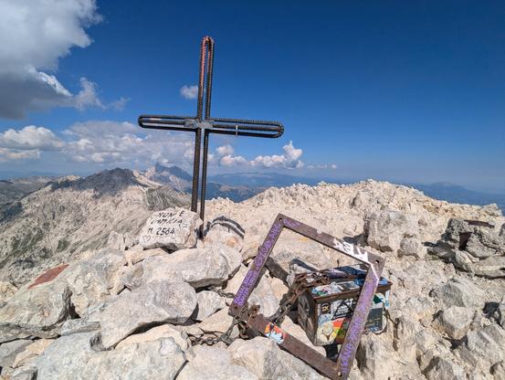 Cross on the summit of Mount Camicia with the Corno Grande in the background