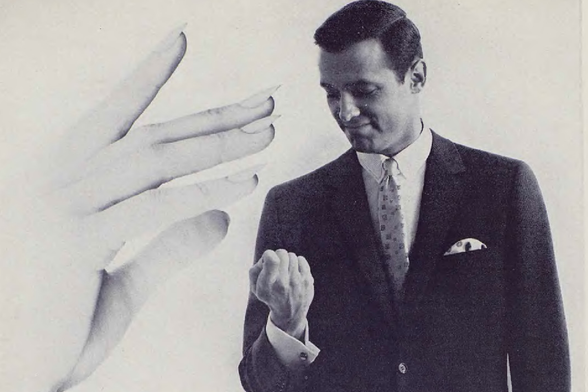 1962 

This is an image of a man wearing a suit and tie.
He appears to be in the middle of a conversation or presentation, as indicated by his posture and facial expression.
Tags: man, suit, tie, business attire, professional, conversation, presenting, hands on another person's hands