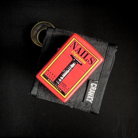 photograph of a Nails Cigarette Zippo lighter, a fictional brand from the movie Clerks and subsequent Kevin Smith movies