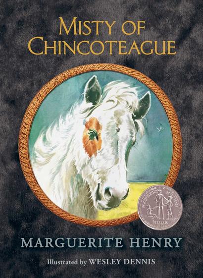 Cover of Marguerite Henry's Misty of Chincoteague. White and brown pony centered in bronze circle on a dark background
