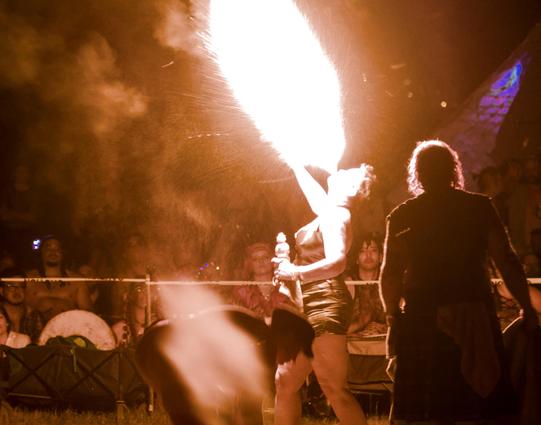 Lady breathes fire to the sky
Onlookers goggle their eyes
A dude with big hair
I guess he was there
but we just remember the fire