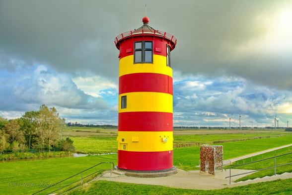 lighthouse at the northsea coast in Pilsum