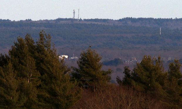 Two cell towers, 433 Clapp Rd, Scituate MA photographed from Buck Hill.