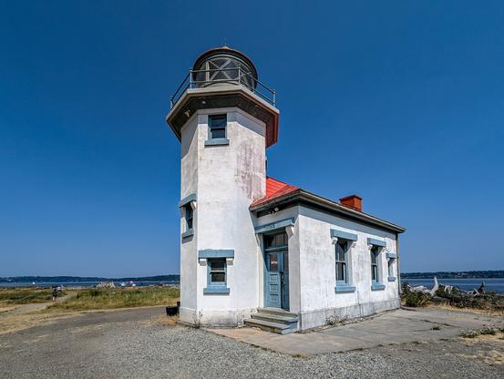 Point Robinson lighthouse. The photo shows the lighthouse, white with a red roof.