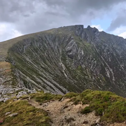 A view of the perfect domestic of Caisteal Abhail from the flanks if Cir Mhor. The very top is crenulated, with granite tors.