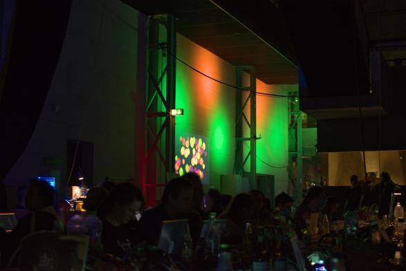 colorful dots projected on a wall in the distance. it's the bytewall
