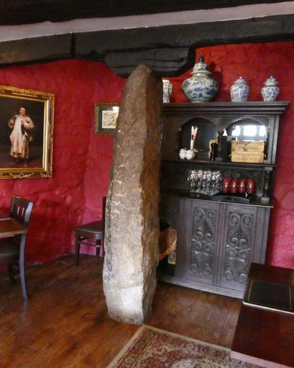 5000 years ago, the Neolithic people of Dartmoor cut this 27 feet high standing stone from granite where The Oxenham Arms is now located.

The pub was built around it when it was a monastery around 800 years ago, the stone goes down into the cellar & up into the room above.