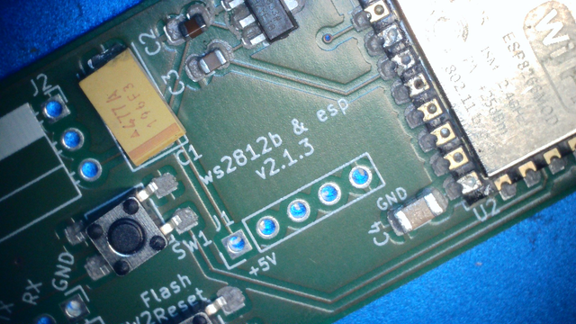 a green pcb.
The components are on it but not yet soldered holding in place with solder paste.
Among other technical writing one can read 'ws2812b & esp V2.1.3"