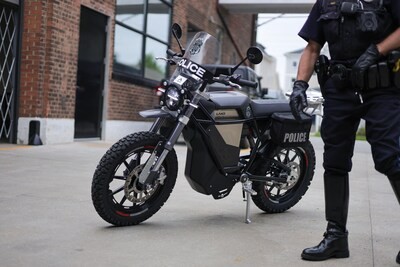 A Land electric motorcycle with police windscreen and panniers