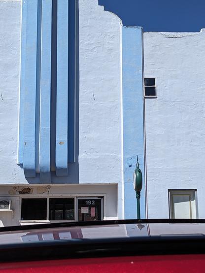 An abstractish view of old art deco movie theater in blue and white.