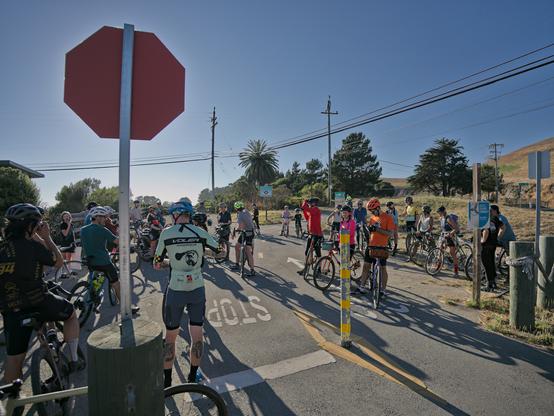 Lael Wilcox surrounded by well wishers at the edge of Santa Cruz CA