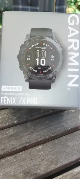 a photograph of the packaging of a Garmin Fenix 7x Pro Sapphire Solar