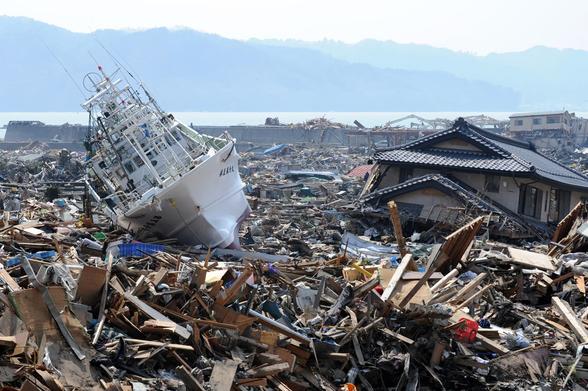 photo - beached ship and destroyed buildings, after Tohoku earthquake and tsunami, Japan