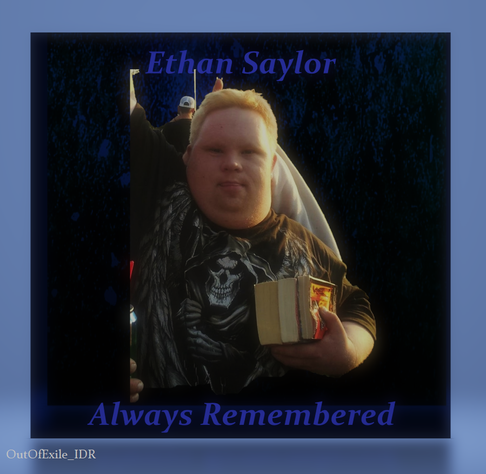 Photograph of Ethan Saylor raising his arm in the air, and holding books in his other hand, with sunlight highlighting the right side of his face. The blue and black gradient background is framed in light blue. The words "Ethan Saylor – Always Remembered" are superimposed on the image. In the bottom quarter in small gray text reads "Out Of Exile_IDR".