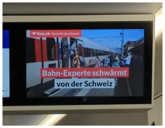 Nachrichten auf dem Bildschirm in einem Zug.
"Bahn-Experte schwärmt von der Schweiz"