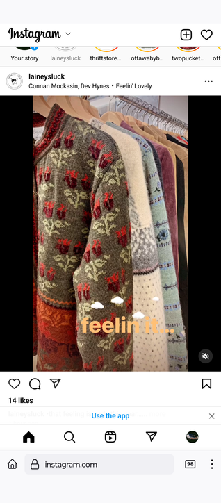 a row of colourful sweaters on a rack.  text overlay reads feelin it....