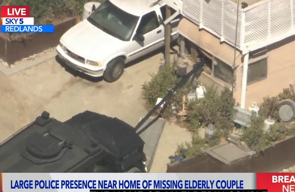 SWAT team bearcat pushing a camera through the front door of a house in Colton/Redlands