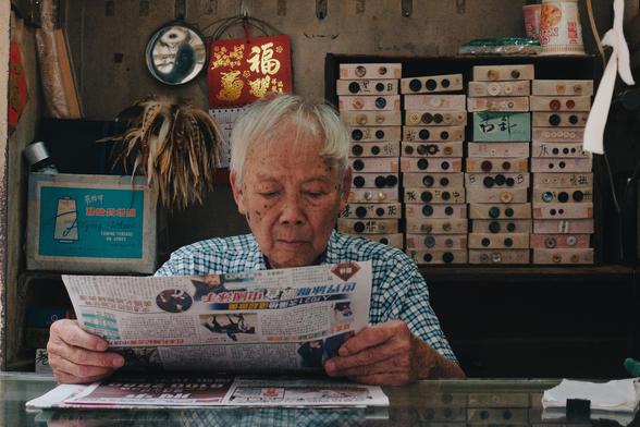 Man reads a news paper