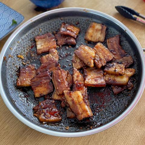 A close-up of the frying pan with the meat.