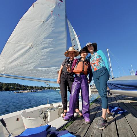 Me with Astrid & Nadene on the dock. Martin 16 sailboat is tied up beside us.