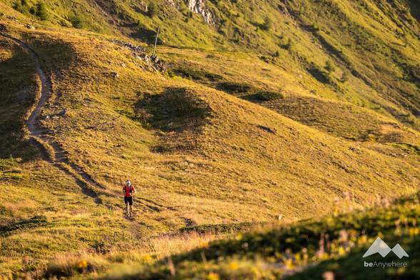 Man running in amazing landscape of the Swiss Alps.