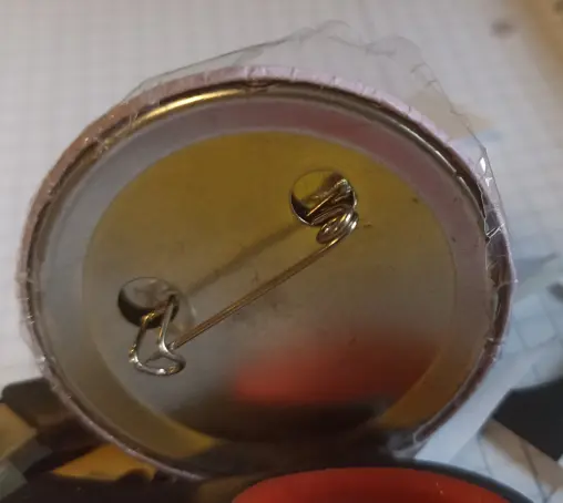 The backside of the same button.