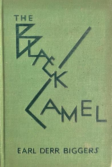 Book entitled 'The Black Cat' by Earl Derr Biggers. One of the Charlie Chan mysteries, printed in 1929. The green cover of the front board shows the title in a playful, spiky style.