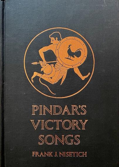 A collection of odes from Ancient Greece entitled 'Pindar's Victory Songs'. It wascompiled by Frank J. Nisetich. The black front board shows a roundel - inside it a Greek youth is running while holding a spear in his left hand and a round shield in the other. The shield features a large black rooster in silhouette. All in shades of burnt yellow, on the black background. the colors often used in ancient greek pottery.