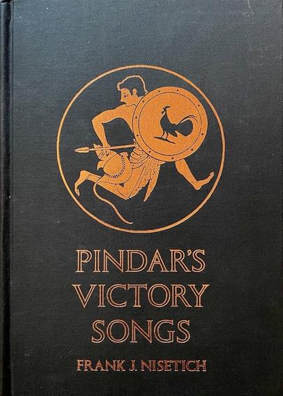 A collection of odes from Ancient Greece entitled 'Pindar's Victory Songs'. It wascompiled by Frank J. Nisetich. The black front board shows a roundel - inside it a Greek youth is running while holding a spear in his left hand and a round shield in the other. The shield features a large black rooster in silhouette.  All in shades of burnt yellow, on the black background. the colors often used in ancient greek pottery.