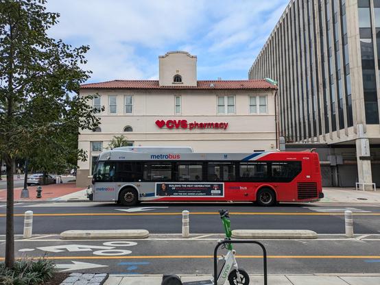 Advertisement on the side of a Metrobus trying to get kids to join the OUC Junior Academy
