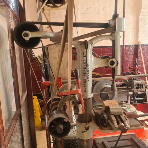 Belt driven drill press