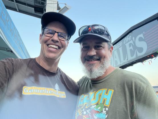 Me on left with brown shirt, hat and glass. Brad with green phish shirt, hat, and glasses on brim.