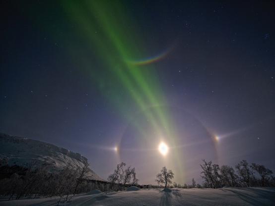 Diamond Moon with Moon dogs, Northern Lights, constellation of the Big Dipper and the North Star - all in one picture! The mountain is the Saana near the village of Kilpisjärvi, Finland.
That was the most magical night ever. Temperature: -28°C.