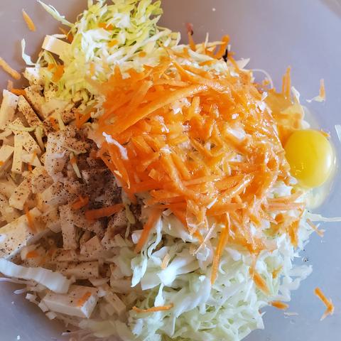 Stuffing ingredients in mixing bowl:

Ground pork
2 eggs
Carrots
Wood ear mushrooms
Turnip
Yellow onion (medium sized one)
Tofu
Rice vermicelli
Cabbage
Chicken broth powder
Ground pepper
Sea salt
Fish sauce
Sesame oil