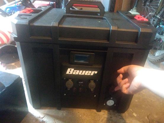 Battery box with switch panel, battery monitor, and AC outlet mounted to the front.