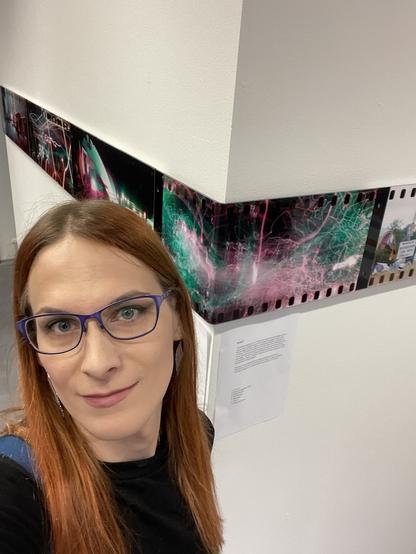 A selfie in front of the photo stripe on the wall behind me.