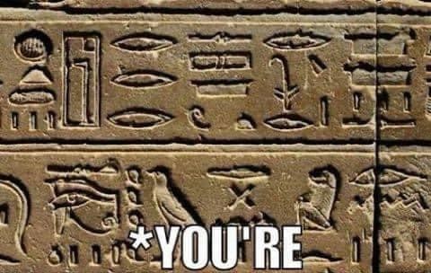 A photo of two lines of hieroglyphics writing, with numerous Egyptian symbols. The meme text over it reads "asterisk You're" -- typical of a spelling correction on social media.