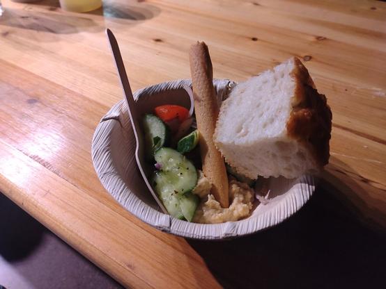 Vegetarian meal at JavaZone 2024 Olives, focaccia, vegan aioli, hummus, artichokes, tomato, and avocado salad