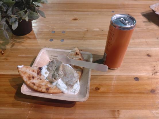Greek meal at JavaZone 2024 Gyros with marinated chicken, tzatziki, tomatoes, and Greek pita bread