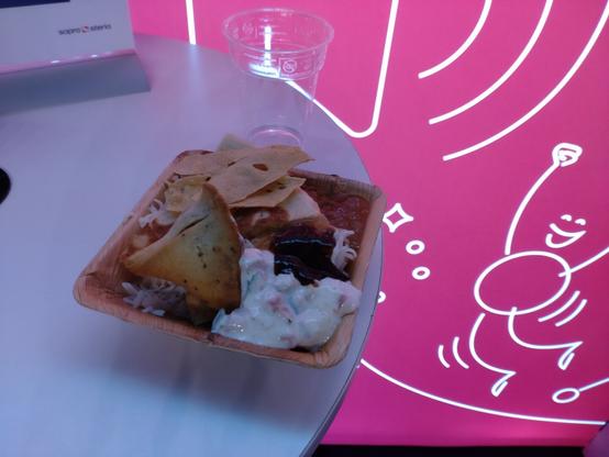 Indian food at JavaZone day 2 Potato and chickpea samosas with pomegranate yoghurt explosion dressing and tamarind sauce Served with fresh naan bread (also took some extra baked in stuff and some papadum)