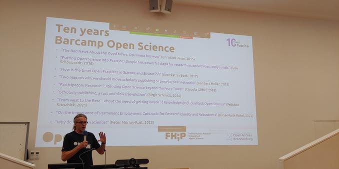 Ten years open science Barcamp slide with the talk titles of the ignition talks from the last 9 years.