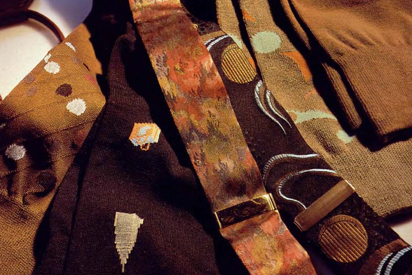 1991 

Various ties with different patterns and designs are laid out.
There is a tie with an interesting pattern, possibly floral or abstract in design.
Tags: neckties, patterns, collection, variety, fashion accessories