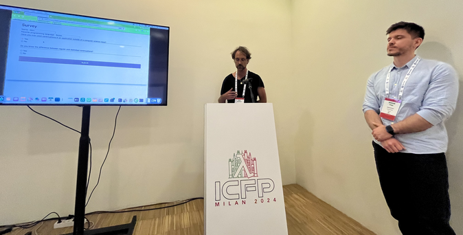 Photo of Marc Kaufmann and Bogdan Popa giving their talk.