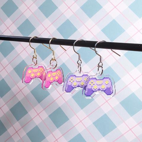 pixel art acrylic game controller earrings in pink and purple
