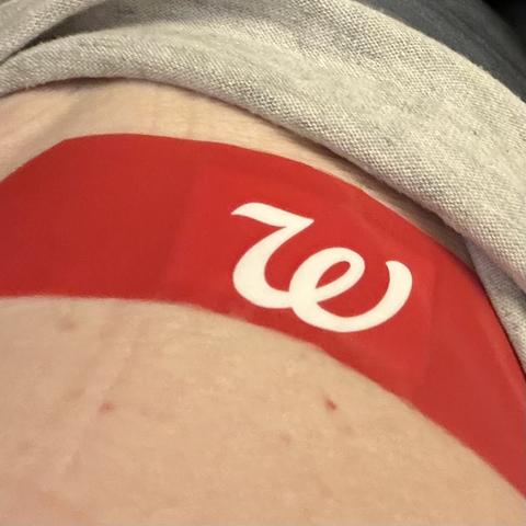 Close-up photo of bright red band-aid with white Walgreens “W” logo on my right shoulder, where I got Flu vaccination.
