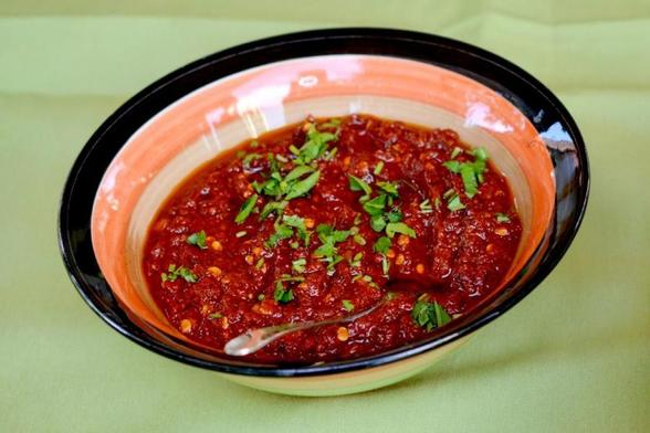 Un bowl with pindjur, a Bulgarian dip.